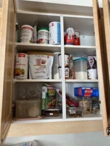 Kitchen cabinet filled with stuff