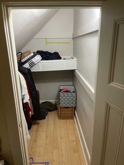 small closet with slanted ceiling