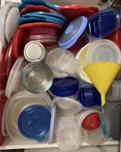 Plastics containers and lids stuffed in a drawer